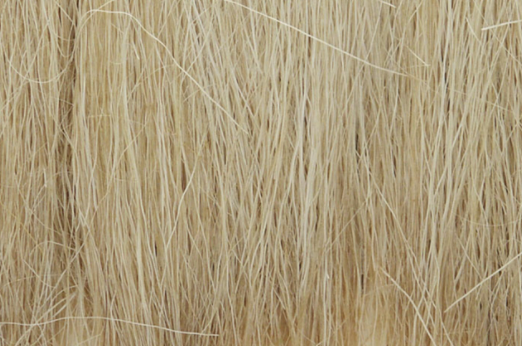 A close-up of natural straw field grass for model train use.