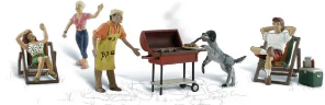 A toy model set depicting a barbecue scene with a man and a dog. The man is wearing a yellow shirt and opening a red barbecue grill.