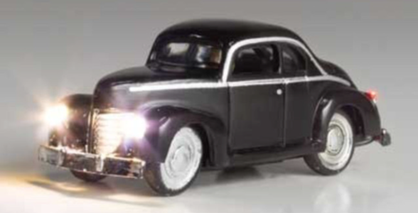 Black N scale model of a 1940s to 1950s coupe with LED headlights and taillights, designed for use in model train sets.