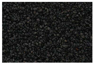A close-up view of fine ballast shaker packaging, predominantly black in color, with small, irregularly shaped black stones illustrated on the surface.