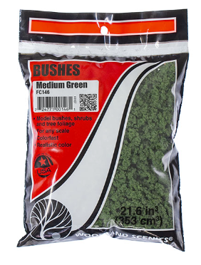 Packaging of Woodland Scenics FC146 Medium Green Bushes, showing a clear plastic bag with medium green model train bushes.