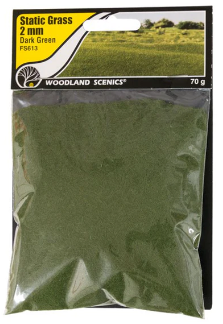 A package of Woodland Scenics FS613 Static Grass in dark green color, weighing 70 grams.