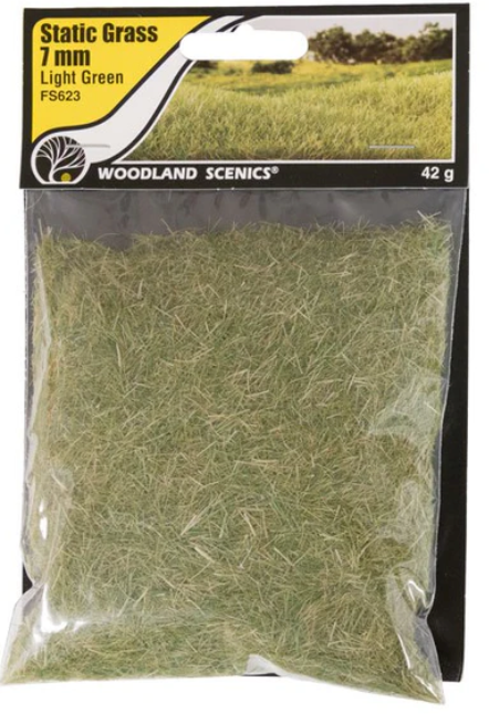 A pack of Woodland Scenics FS623 Static Grass in light green, displayed in a clear plastic packaging.