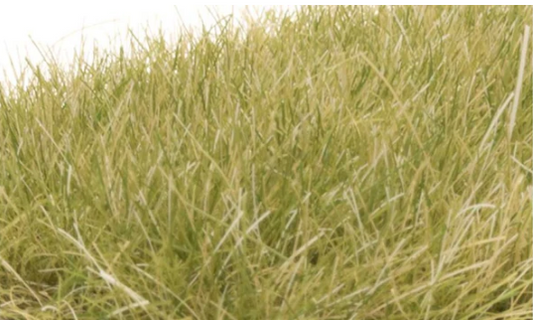A close-up image of static grass fibers for model train use, in light green color, showing various lengths and textures.