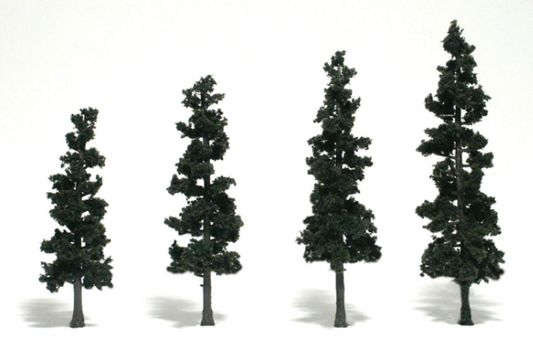 A set of four green conifer trees with detachable bases, intended for model train setups.