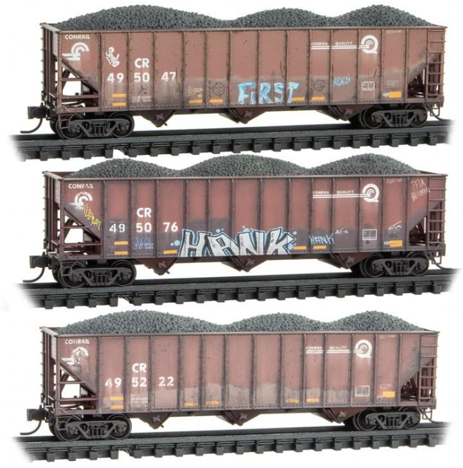 three coal cars with graphics